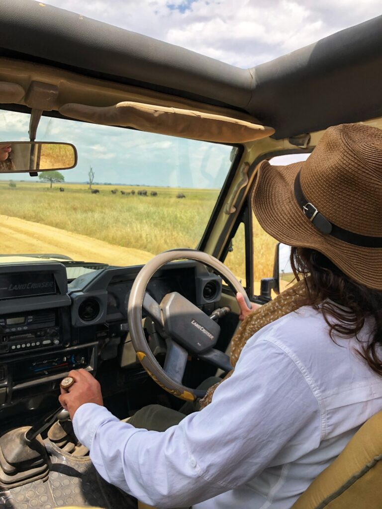 Founder of Venvy Lab, driving a safari vehicle through the Serengeti