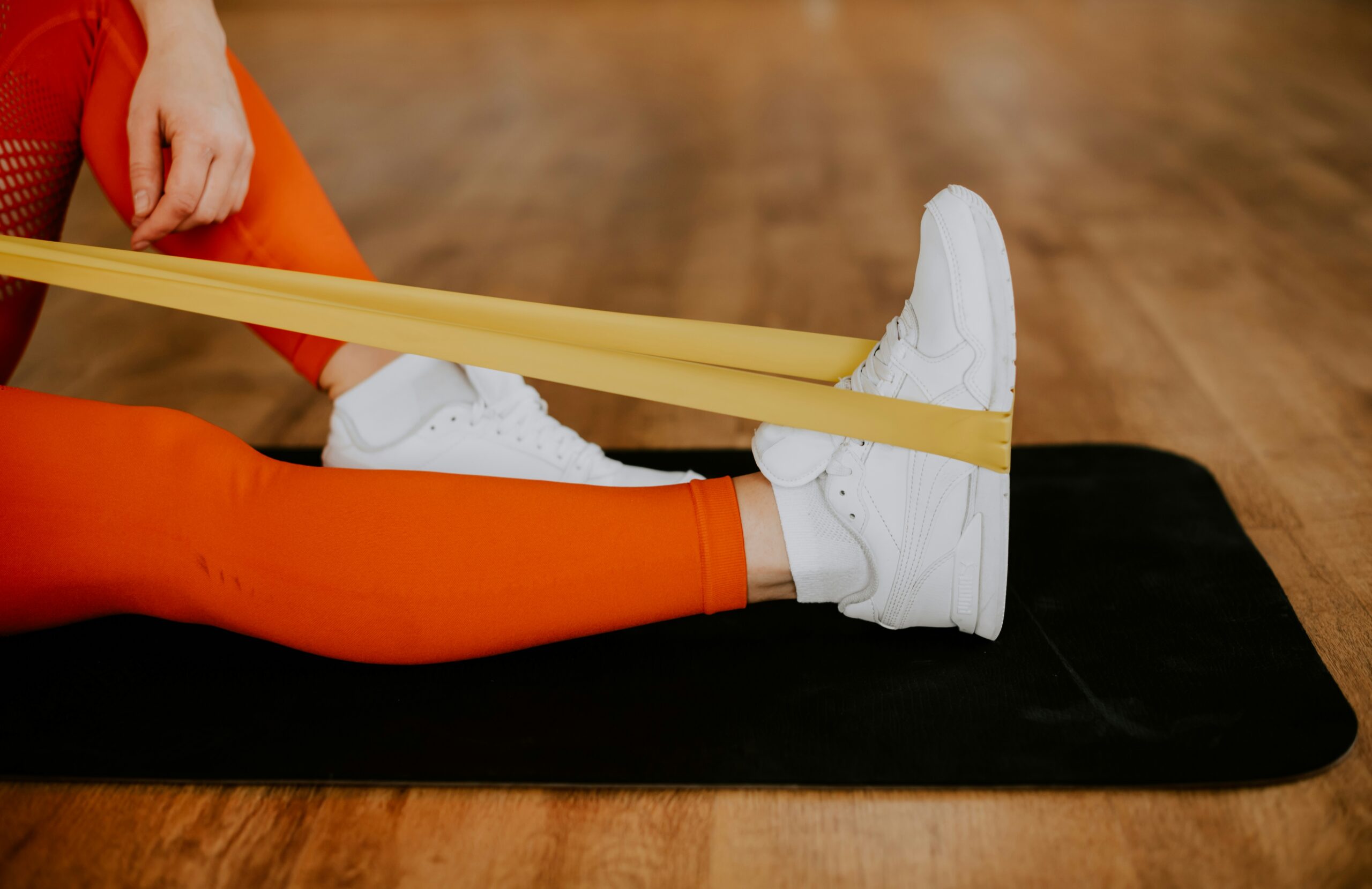 Woman doing resistance band leg exercises