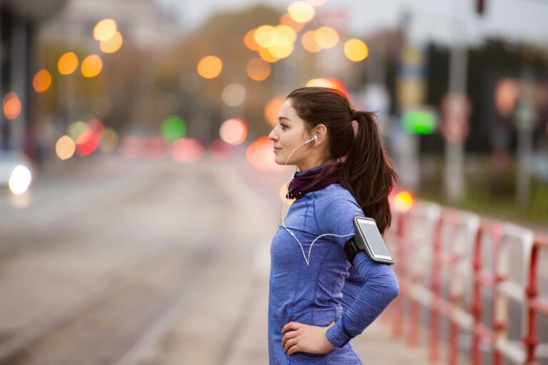 Woman preparing for luteal phase cardio workout on jogging path.