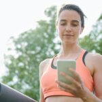 A woman reading The Venvy Method on her phone